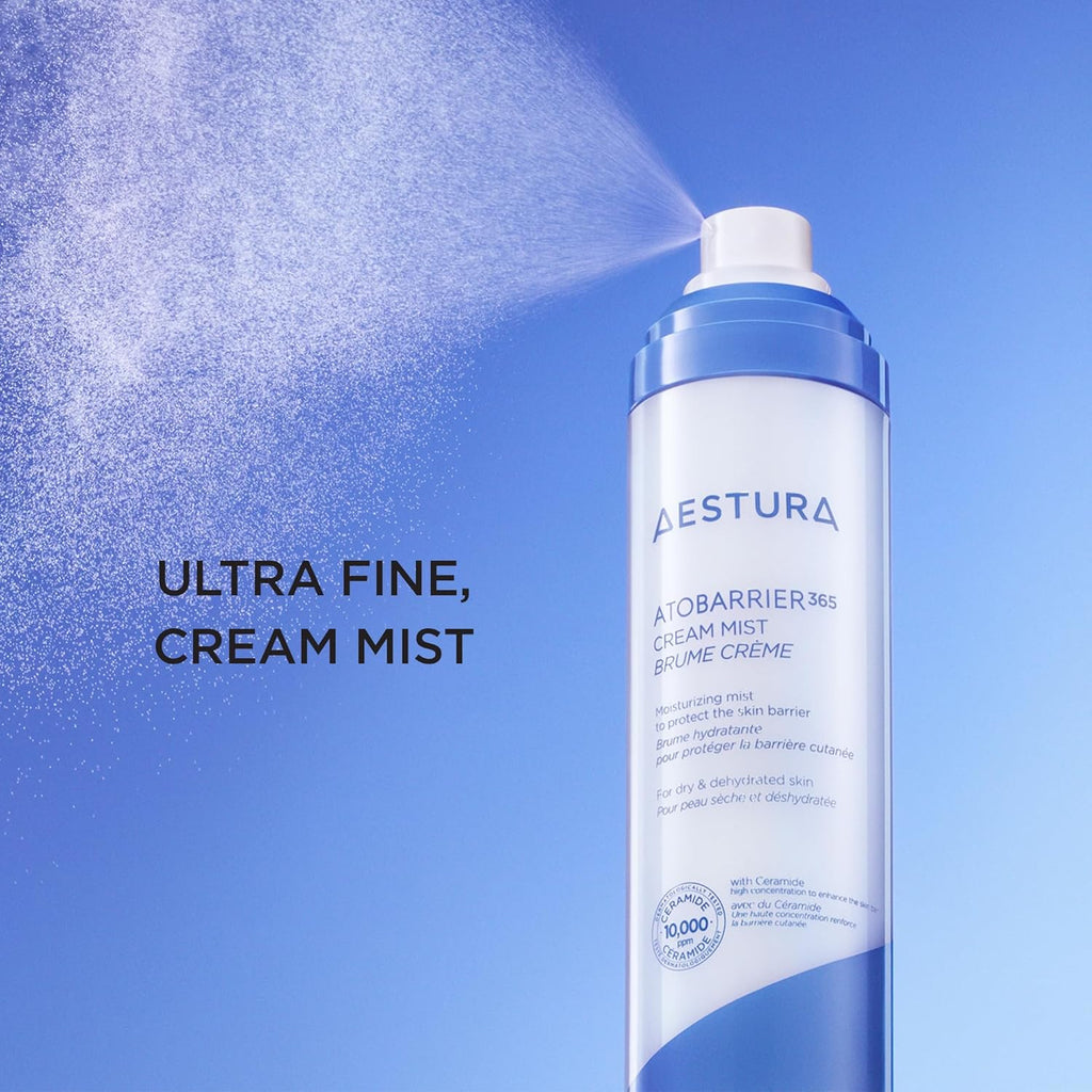 Aestura AtoBarrier365 Cream Mist bottle with mist being sprayed against a blue background
